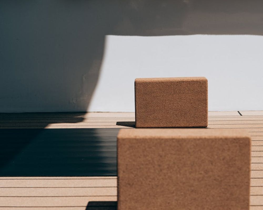 Atmospheric photo of a clean yoga space with soft lighting.