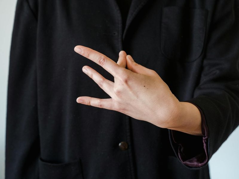 Detailed shot of hands in a meditative mudra position.